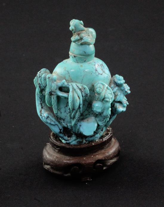 A Chinese turquoise matrix snuff bottle, late 19th / early 20th century, 6.5cm., wood stand, repair to cover